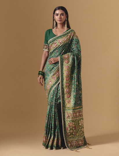 Green art silk patola saree with refined traditional festive appeal