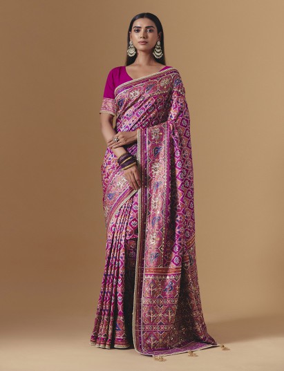 Rani pink art silk saree featuring elegant animal patola motifs