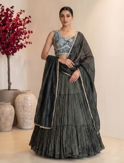 Bottle green tiered crepe silk couture reception lehenga