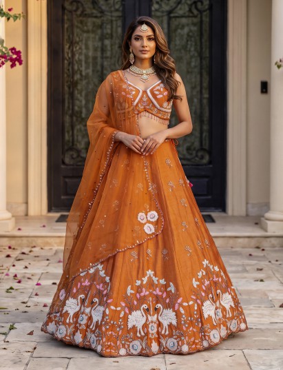 Rust orange raw silk embroidered swan motif lehenga choli
