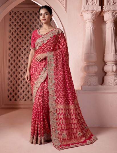 Rani pink festive bandhani saree with handcrafted zari motifs