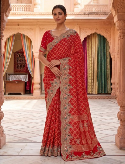 Red luxury georgette saree with peacock embroidered border