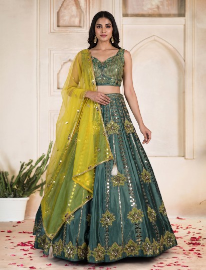 Green silk lehenga choli with vibrant mirror patchwork contrast dupatta
