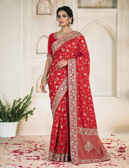 Red dola silk saree adorned with floral pearls zardosi and zari