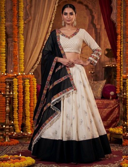 Off white kutchi heritage lehenga with folk artistry