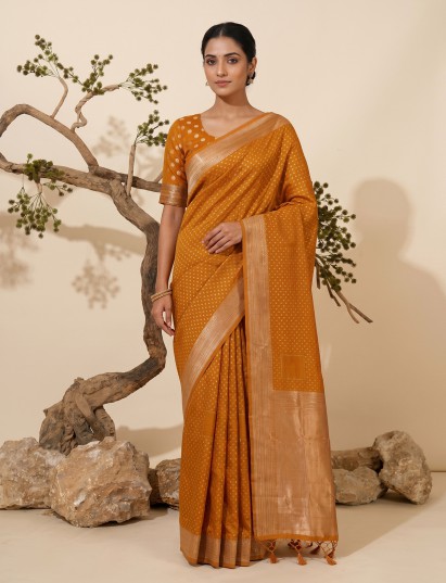 Vibrant orange festive zari semi silk saree