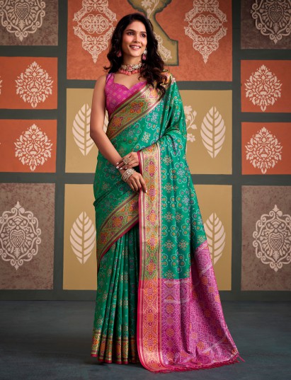 Regal green geometric patola silk saree with contrast pink blouse