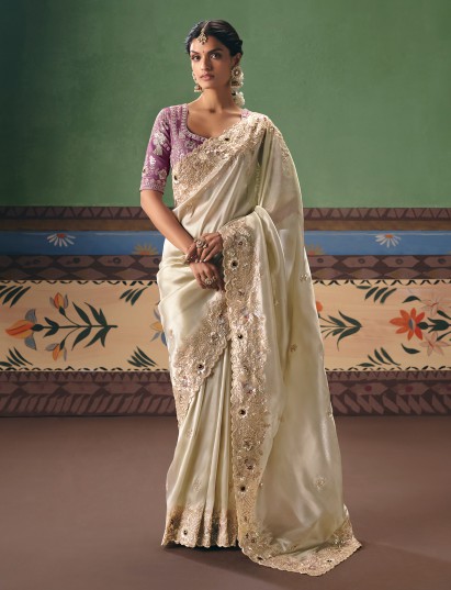 Cream fancy silk saree paired with contrast blouse