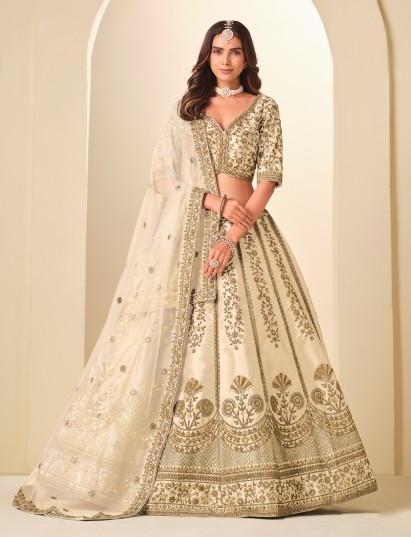 Cream art silk lehenga choli adorned with resham and sequins