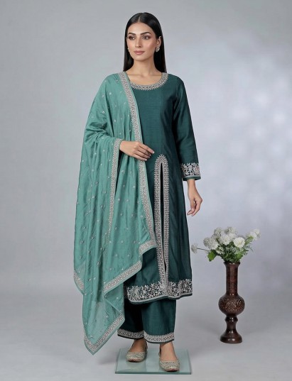 Green silk festive palazzo suit with embroidery and contrast dupatta