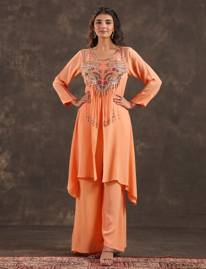 Light peach yoke style palazzo suit with festive embellishments