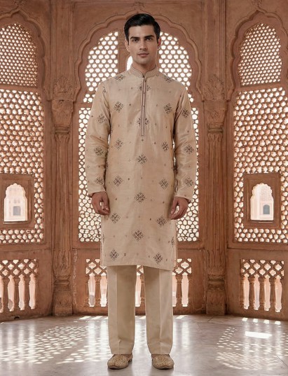 Cream silk embroidered kurta suit with festive sequin detailing