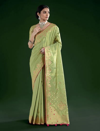 Pista green tissue silk saree with golden zari detailing