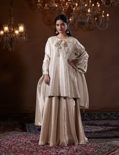Off white dola silk designer palazzo suit for festive