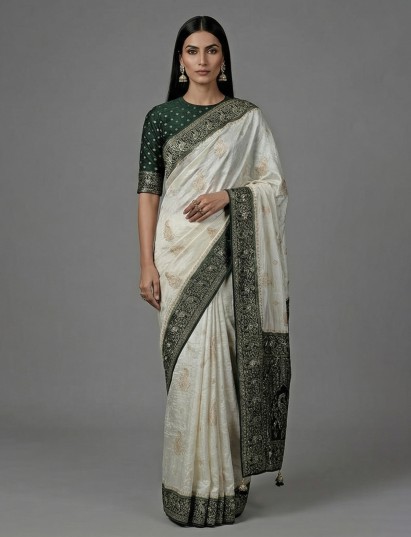 Cream dola silk embellished festive wear saree