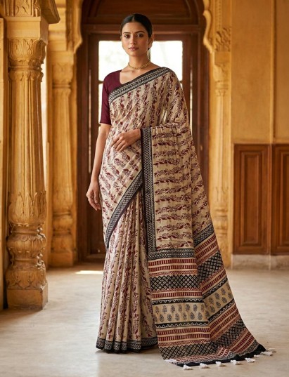 Off white muslin saree showcasing ethnic design