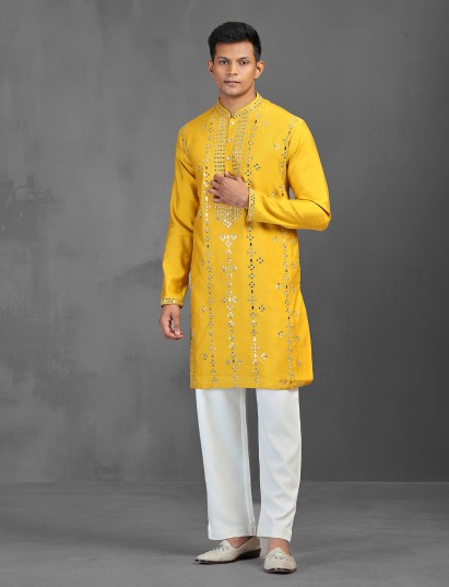Yellow art silk kurta suit adorned with mirror work for men