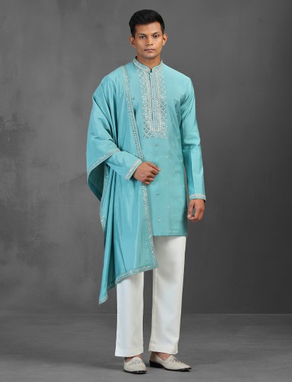 Firozi blue art silk kurta suit paired with matching dupatta