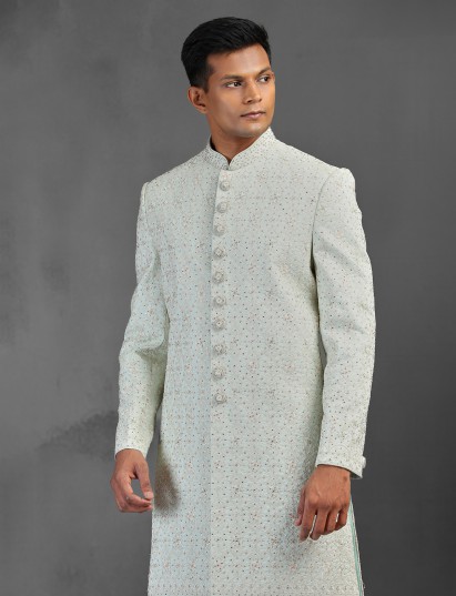Light pista silk sherwani with intricate thread and stone work