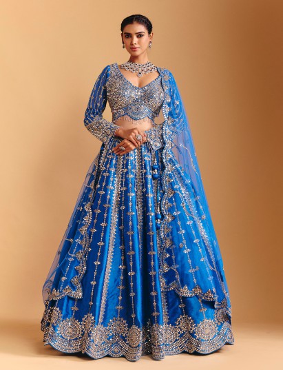 Blue raw silk lehenga choli with mirror and stone work
