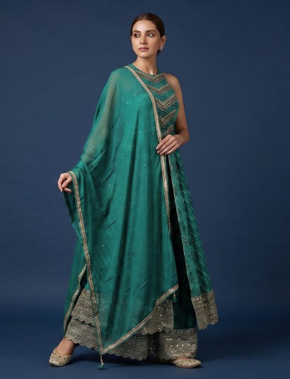 Green silk anarkali palazzo suit with rich embellishments