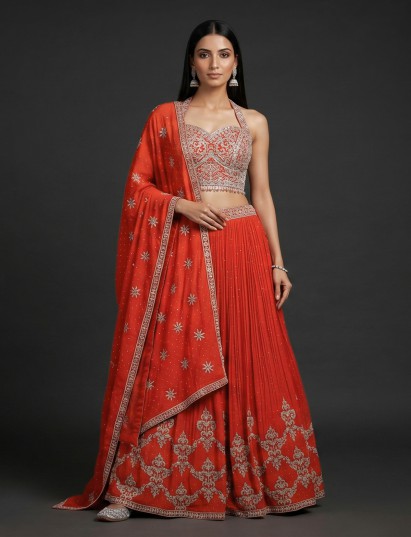 Orange georgette lehenga choli with mirror and tassel accents