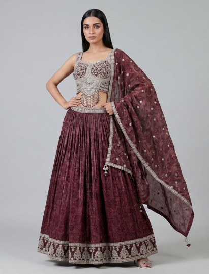 Wine silk bandhej lehenga choli with mirror and tassel work