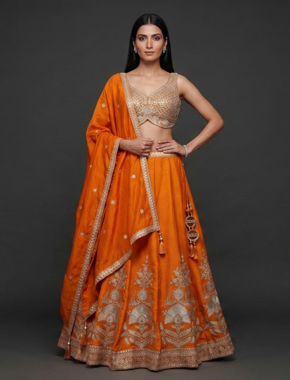 Orange silk lehenga choli with embroidery and stone work