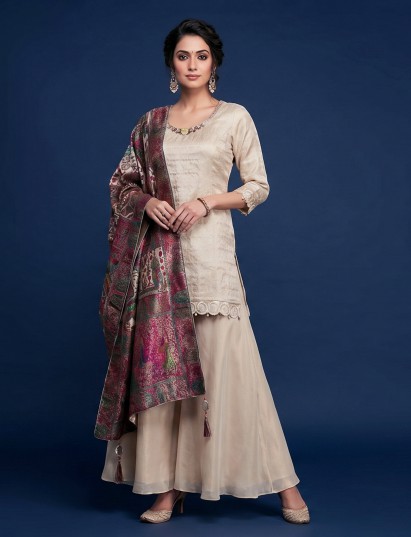 Cream silk palazzo suit with pearl and tassel detailing