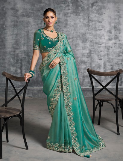 Green viscose tissue saree with rich embellishments