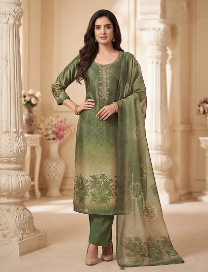 Green silk suit with vibrant floral embellished design