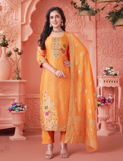 Orange silk suit with vibrant floral embellished elegance