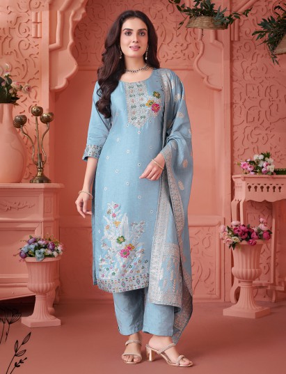 Sky blue silk suit with intricate festive embellishments