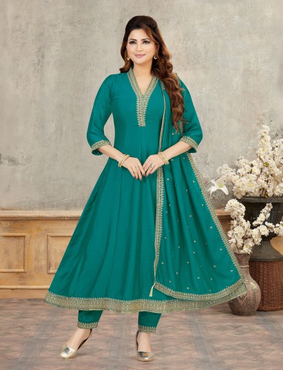 Rama green silk anarkali suit with elegant shimmer