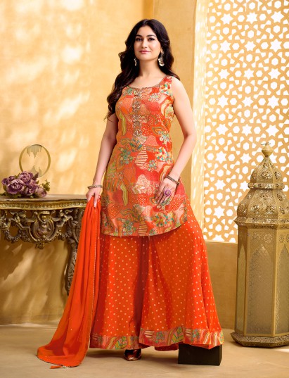 Orange silk palazzo suit with intricate mirror work