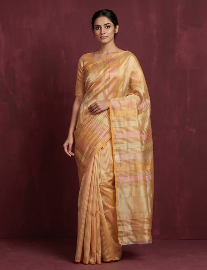 Peach organza saree with graceful stripes for festive evenings