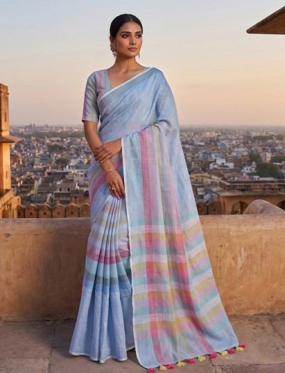 Mint blue striped linen saree with tassel pallu elegance