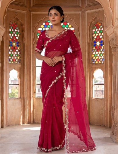 Red organza tissue saree featuring luxurious cutdana work
