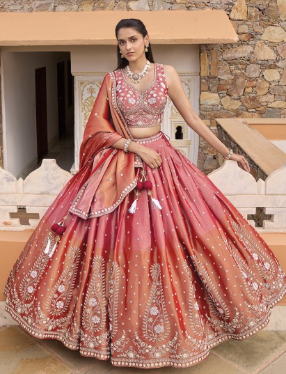Pink silk lehenga choli with shaded dupatta and resham embellishments