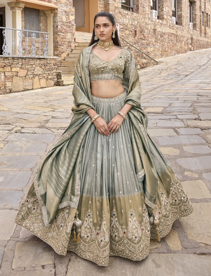 Grey silk lehenga choli with peacock motifs and shaded dupatta
