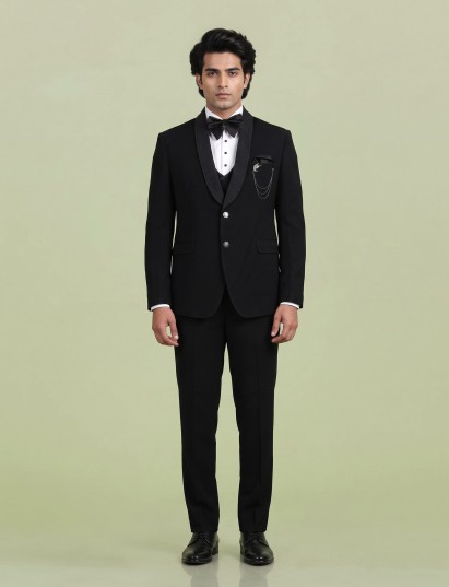 Jet black three-piece tuxedo suit with crystal brooch and cutdana