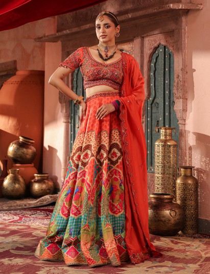 Red traditional print lehenga choli with elegant embellished dupatta